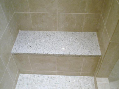 custom concrete bench in shower with embedded glass