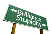 sign showing one way to brilliance the other to stupidity