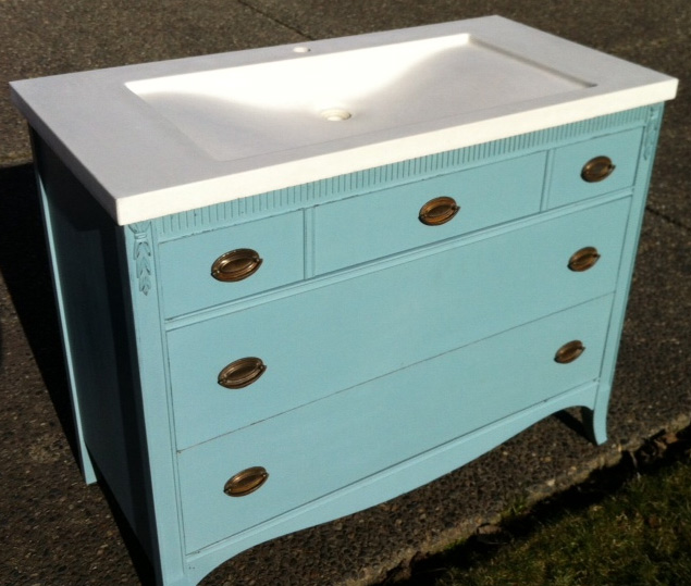 pale blue antique dresser with white concrete sink