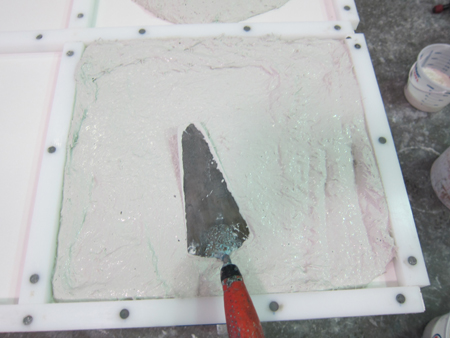 white GFRC concrete sample in square plastic mold