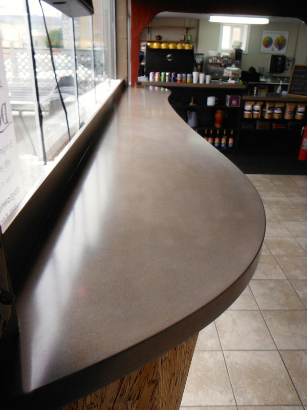 curved concrete countertop bartop in coffee shop
