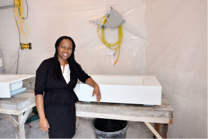 woman standing with white integral concrete sink