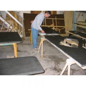 inspecting concrete countertop slabs in shop