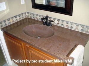 bathroom concrete countertop with integral sink and integrated towel rack