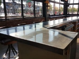 glossy gray concrete bartop in restaurant by Ramcrete Oklahoma