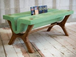 This gorgeous green concrete table doubles as a magazine rack