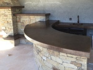 curved concrete bartop and masonry in outdoor kitchen by Price Concrete Studio