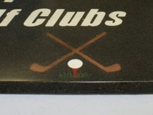 closeup of concrete countertop with golf logo embedded