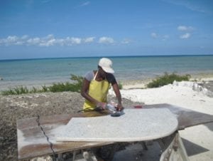 polishing concrete countertops outdoors on beach in Bahamas