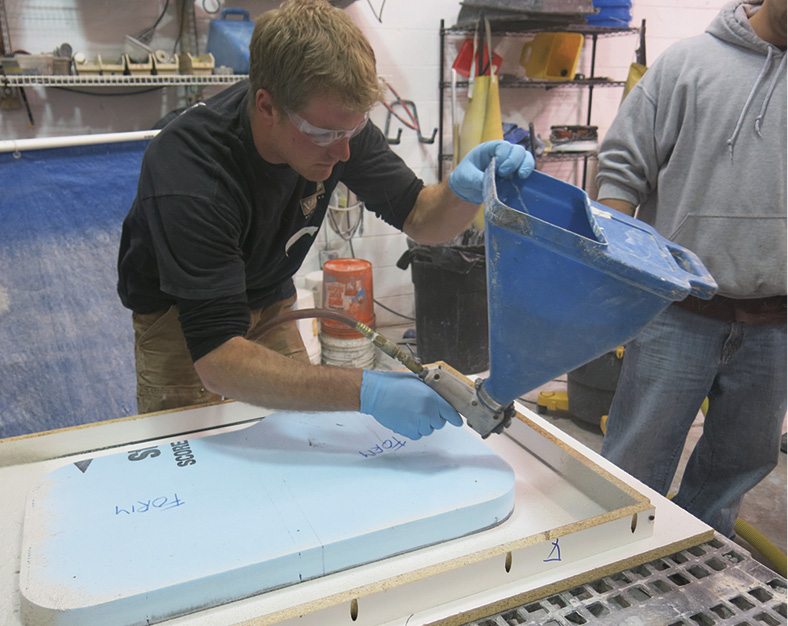 spraying GFRC mist coat into form mold for concrete countertop