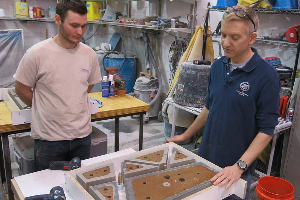 Justin McRae and Jeff Girard with rubber concrete mold