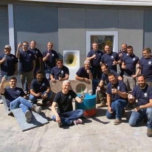 concrete countertop institute training alumni with concrete lounge chair and class projects