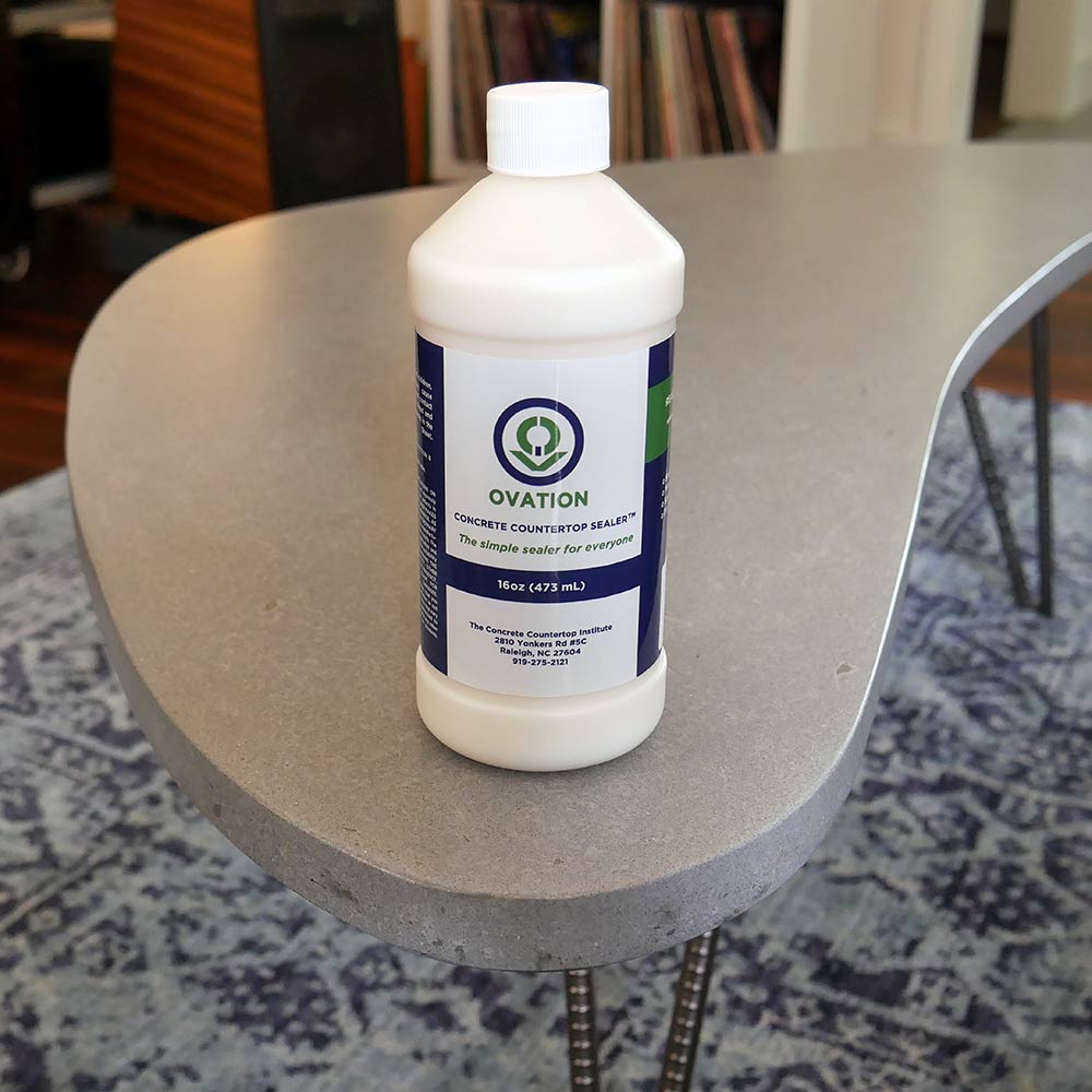 Ovation Concrete Countertop Sealer on curved concrete furniture coffee table