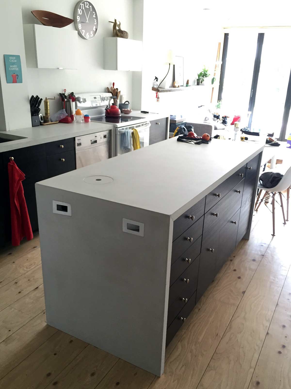 DIY concrete countertop kitchen island with waterfall end