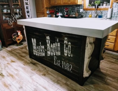 Kitchen island concrete top with 4 inch drop sides in blended white and bisque colors.