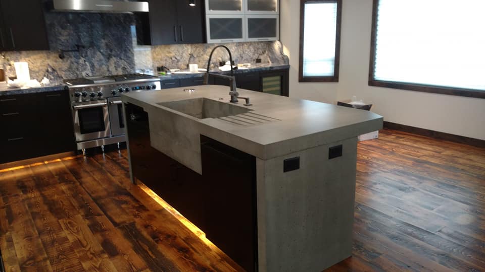 concrete kitchen island countertop with integral sink and drainboard by MC Countertops in WA