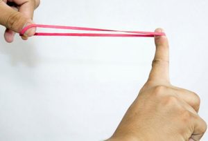 stretching red rubber band